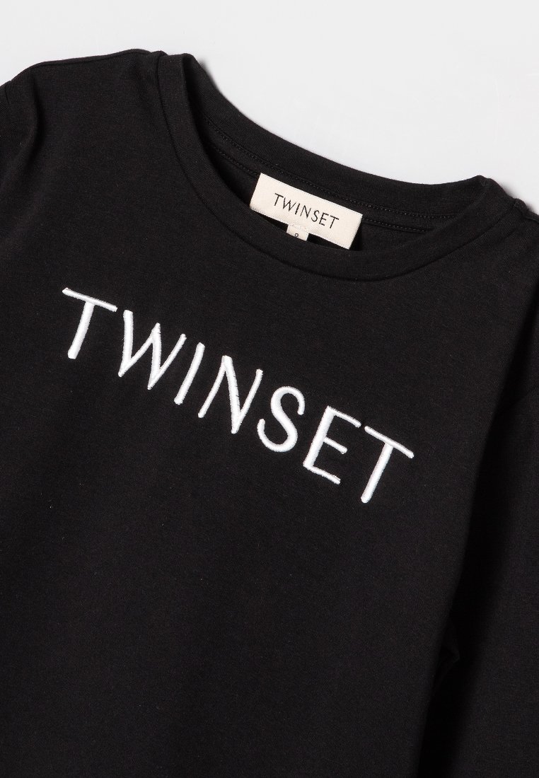 T-shirt en coton noir avec broderie blanche "TWINSET" sur la poitrine, col rond et manches courtes.