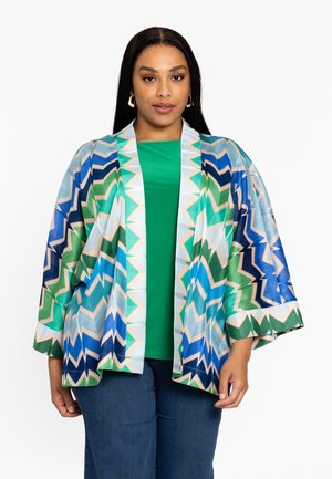 Kimono-jack in een levendig chevronpatroon met blauw, groen en beige tinten. Lichtgewicht stof, open voorkant, brede mouwen.