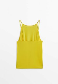 Débardeur côtelé jaune sans manches à fines bretelles, étalé à plat sur un fond blanc.