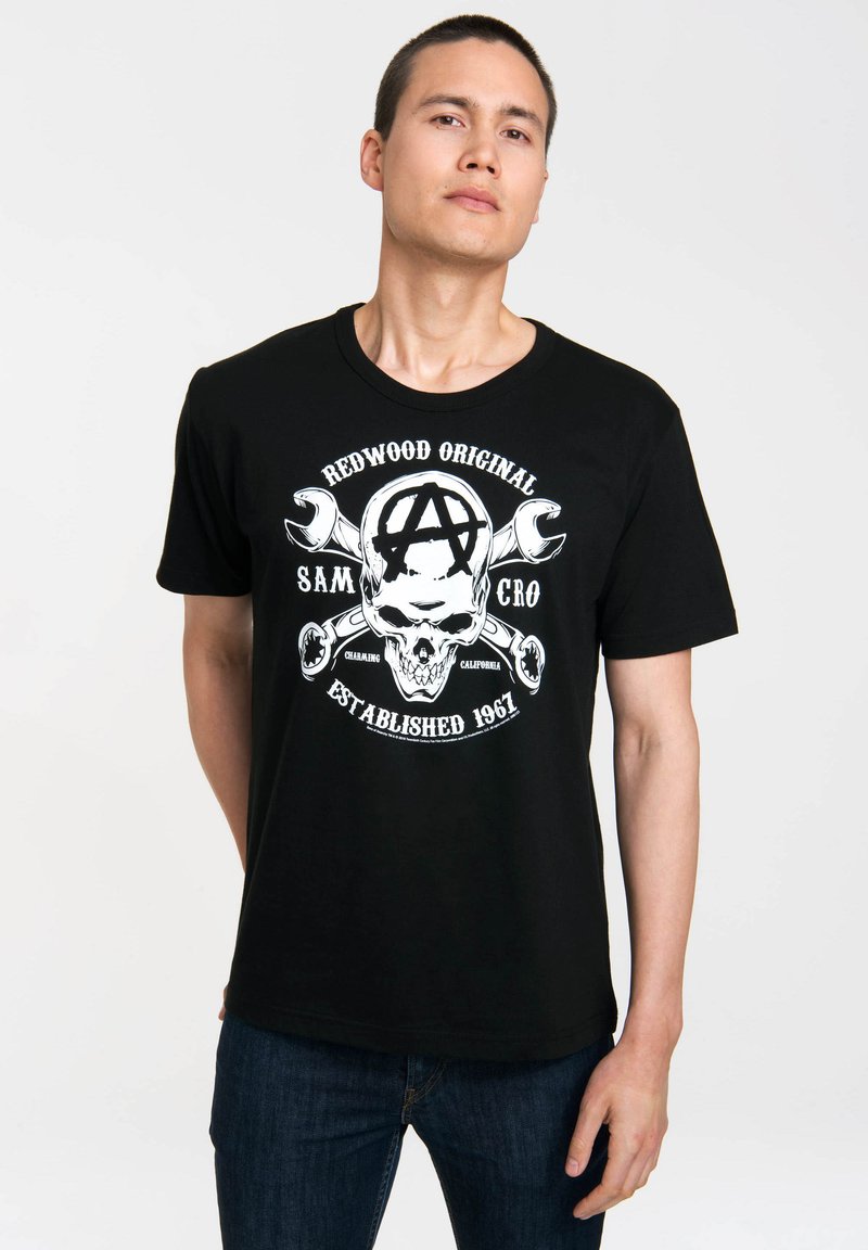 Black cotton t-shirt with short sleeves, round neck, featuring a white skull and wrench graphic, text "Redwood Original" and "Established 1967."