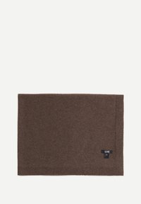 Écharpe rectangulaire en mélange de laine marron, avec une texture douce, présentant une petite étiquette marine dans un coin. Les bords sont soigneusement cousus.
