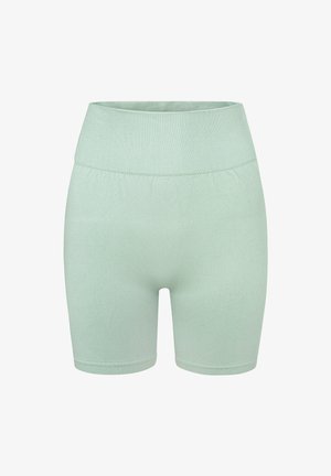 Mündroheline, veniv, kõrge vöökohaga lühikesed püksid, millel on sile tekstuur ja elastne vöökoht. Ei ole nähtavaid õmblusi ega mustreid.