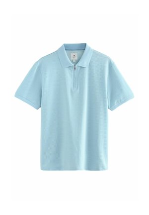 Ljusblå polo tröja med dragkedja i kragen, korta ärmar och textil med en subtil struktur.