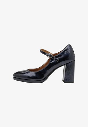Talons Mary Jane en cuir vernis marine avec un bout rond, une bride de cheville ajustable et un talon épais texturé pour une meilleure adhérence.