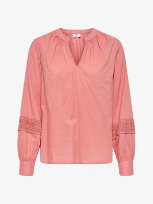 Long-sleeve rose pink blouse with V-notch collar, gathered neckline, and intricate lace trim on mid-sleeves ending in buttoned cuffs.