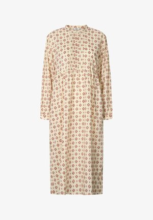 Sukienka z długim rękawem w jasnobeżowym kolorze, z czerwonym geometrycznym wzorem i plisowanymi detalami z przodu. Luźny, zwiewny krój.