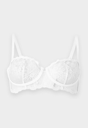 Biały koronkowy biustonosz z fiszbinami, haftem kwiatowym, regulowanymi ramiączkami i falistymi krawędziami na jednolitym tle.