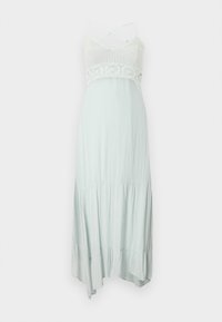 Gai minta zaļa maxi kleita ar adītu augšdaļu, mežģīņu akcentiem un regulējamiem krustveida plecu siksnām, ar plūstošu, slāņotu svārku.