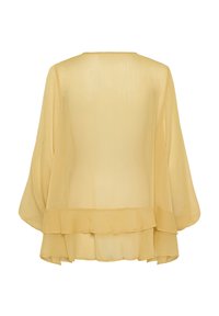 Geel lichtgewicht blouse met een vloeiende ontwerp, lange mouwen en een gerimpelde zoom aan de onderkant. De textuur lijkt doorschijnend en zacht te zijn.