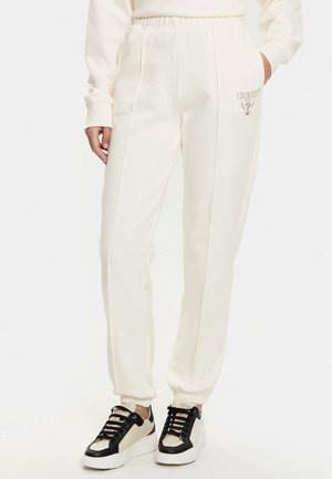Pantaloni da jogging bianchi realizzati in un tessuto morbido, con una cintura elastica, tasche laterali e un piccolo logo ricamato sulla parte frontale.