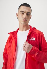 The North Face WINDSTREAM SHELL - Windbreakers - high risk red