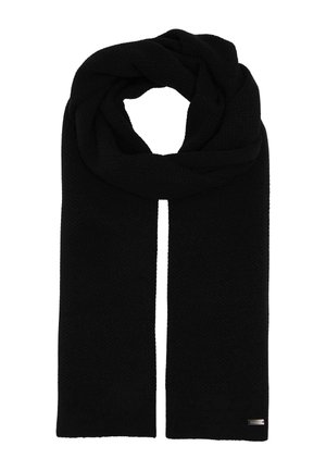Long black knit scarf folded with a loop at top, featuring a small silver rectangular brand tag on one end.