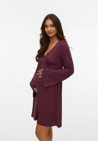Oblačilo za materinstvo v temno burgundski barvi, dolgi zvonasti rokavi, mehak material, v-izrez, poudarja okroglo obliko trebuha.