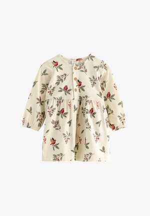 Langzaam, romig gekleurd jurkje met een gathered taille, met een patroon van vogels en bladeren, houten knopen en elastische manchetten.