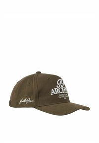 Brown baseball cap with white embroidered text "ARCHI" and "Jackie & Goner." Features a curved brim and adjustable strap. Cotton material.