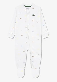 Λευκό βαμβακερό φορμάκι με πολύχρωμα σχέδια κροκοδείλων σε μπλε, κίτρινο και καφέ. Διαθέτει φερμουάρ εμπρός και καλυμμένα πόδια.