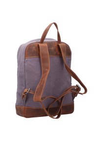 Zaino in tela viola con dettagli in pelle marrone, dotato di spallacci regolabili, maniglia superiore e caratteristiche di cucitura.