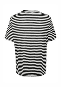 Black and white striped short-sleeve t-shirt with a round neckline and a relaxed fit. Soft fabric with horizontal stripes of varying widths.