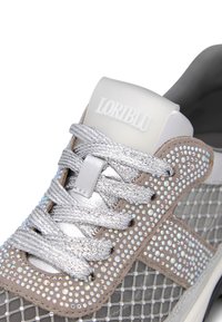 Gray sneaker featuring a mesh design with silver rhinestone embellishments, textured laces, and a logoed plastic heel counter.