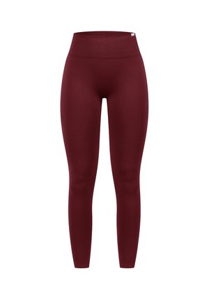 Bordeaux hoge taille leggings gemaakt van rekbare, gladde stof. Standaard pasvorm zonder zichtbare naden of patronen, wat een slanke silhoeët biedt.