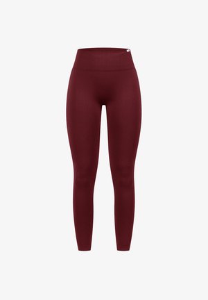 Leggings burdeos de cintura alta fabricados con un tejido elástico y suave. Ajuste estándar sin costuras o patrones visibles, que ofrecen una silueta elegante.