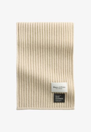 Beige cashmere scarf with vertical ribbing texture, featuring a white label and a black tag with care instructions and brand details.