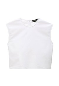 Débardeur blanc sans manches avec un col rond et une fermeture éclair à l'arrière. Fabriqué dans un tissu lisse, il présente des épaules légèrement sculptées.