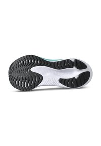 Shoe sole with a white base, black rubber tread, and wavy patterns; features a textured grip and accentuated grooves for traction.