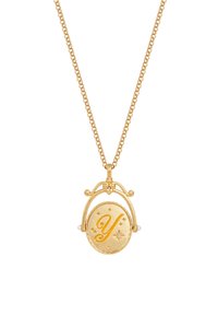 Kultainen riipuskaulakoru, jossa on pyöreä charm-riipus kohotetulla "Y"-kirjaimella ja tähtikuvioilla, ripustettuna teksturoidusta ketjusta.