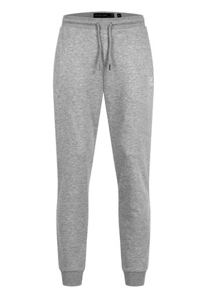Pantaloni jogger in cotone grigio chiaro con elastico in vita, coulisse e polsini alle caviglie, con un piccolo logo discreto sulla coscia destra.