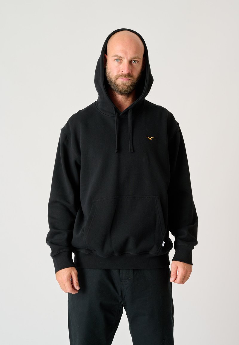 Black hooded sweatshirt made of cotton blend, featuring a front pocket and embroidered logo in yellow on the chest. Casual fit with ribbed cuffs.