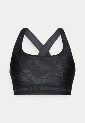 Schwarzer Sport-BH mit strukturiertem Design und verstellbaren, gekreuzten Trägern. Verfügt über ein Logo-Band am unteren Ende in einem passenden dunklen Ton.