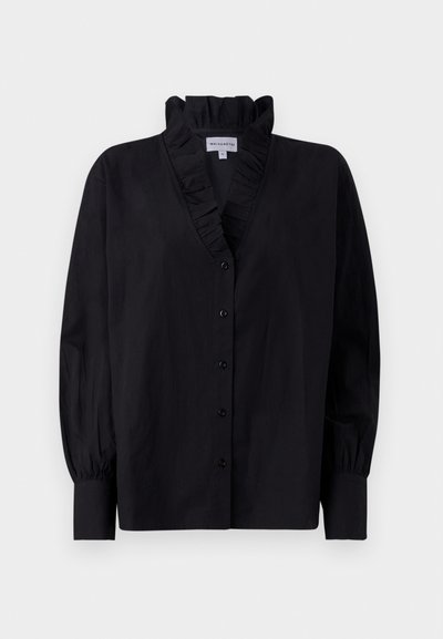 Black blouse with a ruffled collar and long, puffed sleeves. Features a button-down front and a loose fit in a smooth fabric.