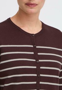 Maroon cardigan with cream horizontal stripes, round neckline, and five dark buttons. Soft textile with ribbed edges.
