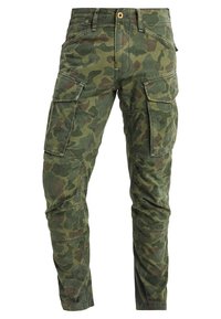 Kapsáčové kalhoty v maskáčovém vzoru, převládá zelená barva s hnědými akcenty. Mají čtyři kapsy a zapínání na zip s knoflíkem.