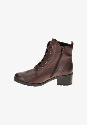 Braune Leder-Stiefeletten mit runder Spitze, schnürbare Vorderseite, seitlichem Reißverschluss und niedrigem Blockabsatz. Strukturiertes Obermaterial und Gummisohle.