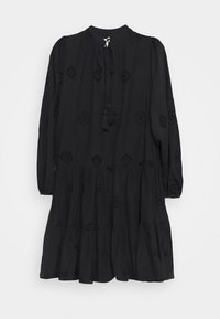 Black dress made of lightweight fabric, featuring long sleeves, a round neckline, a tiered skirt, and decorative eyelet cutouts with tassels.