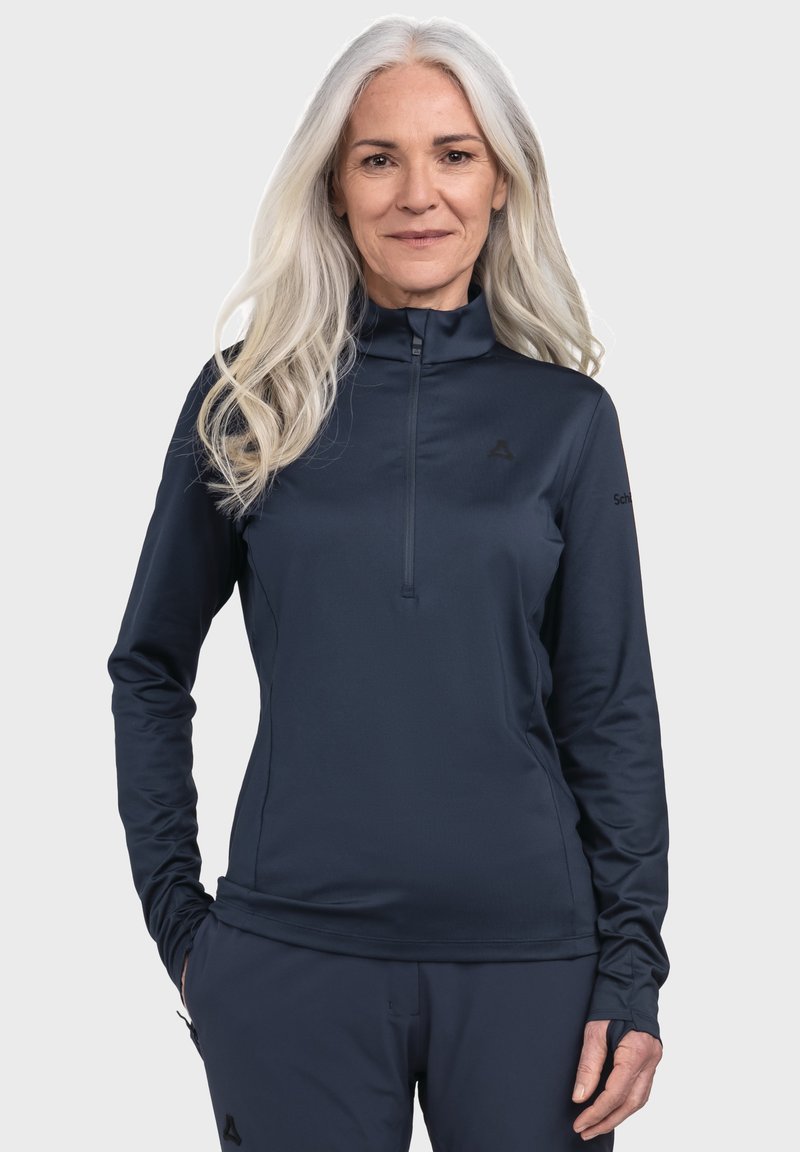 Navyblaues Langarm-Top mit Viertelreißverschluss aus glattem, leichtem Stoff; mit hohem Kragen und subtilen Logodetails auf der Brust.