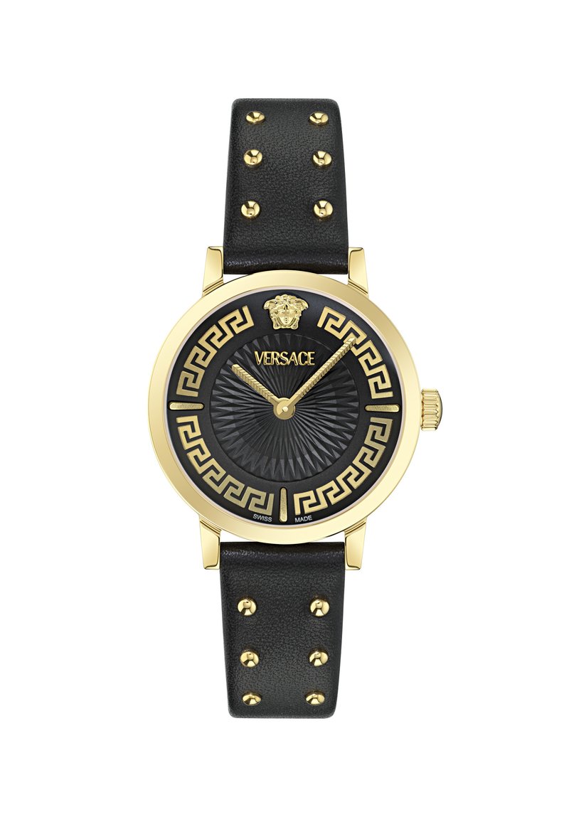 Gold-tone watch with black leather strap, featuring gold studs, a black patterned dial, and Greek key design. Versace logo at the top.