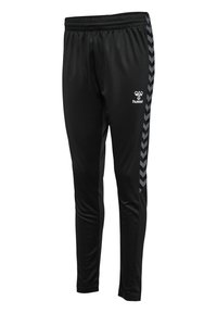 Schwarze Sporthose mit elastischem Bund, ausgestattet mit einem grauen Chevron-Muster an den Seiten und einem kleinen Logo auf der Vorderseite.