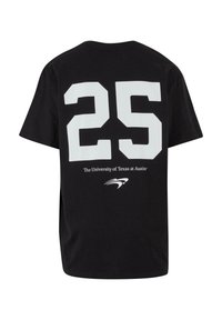 Sort bomulds t-shirt med et stort hvidt "25" på ryggen, med teksten "The University of Texas at Austin" og et logo nedenfor.