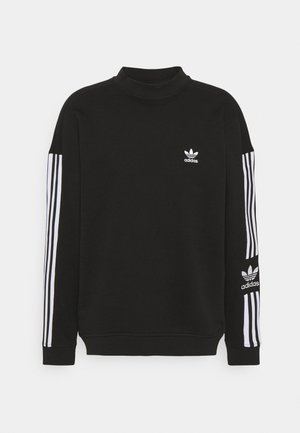 Felpa nera con collo alto, logo Adidas bianco sul petto e tre strisce bianche lungo ogni manica. Tessuto morbido con polsini a coste.