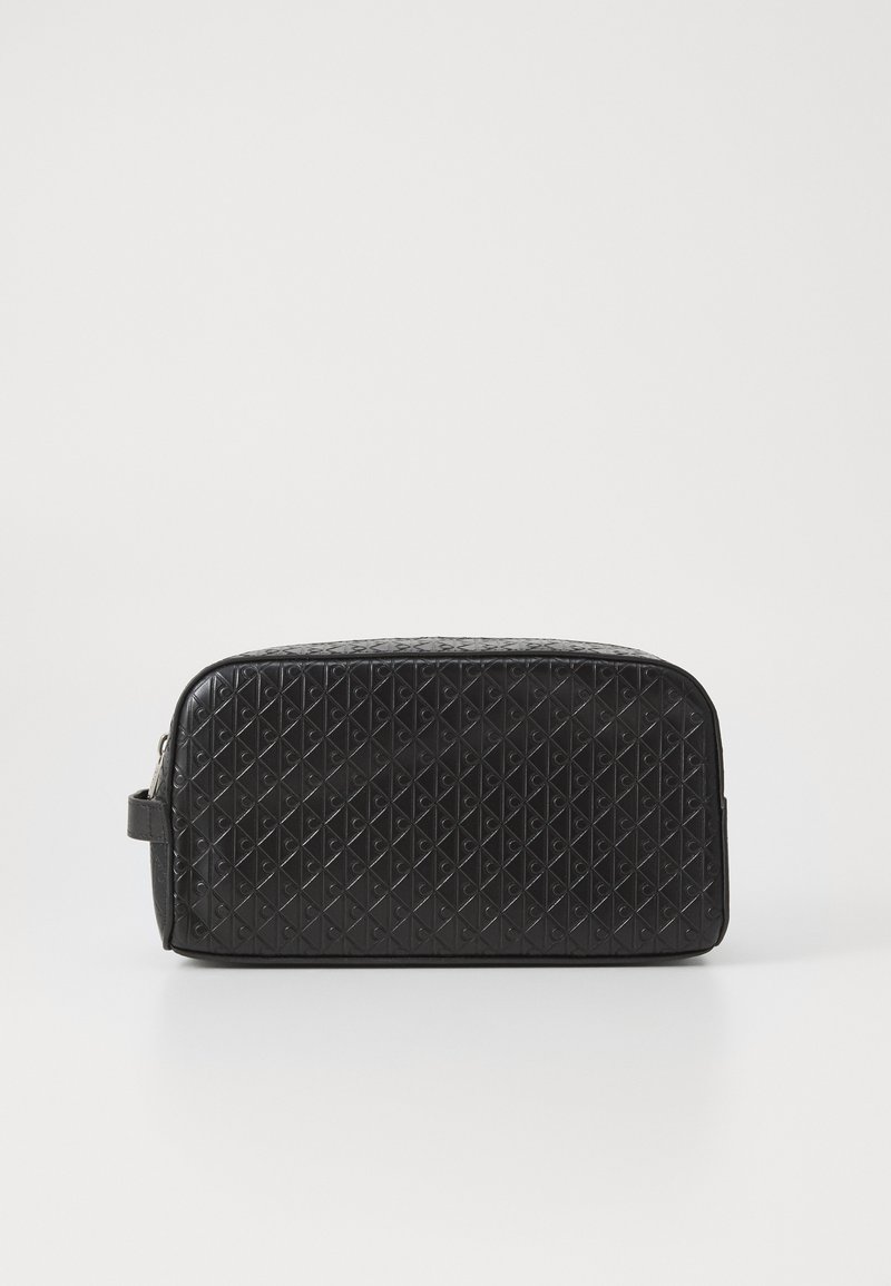 Black synthetic toiletry bag with a textured diamond pattern, rectangular shape, smooth finish, and a side handle. Silver zipper accent.