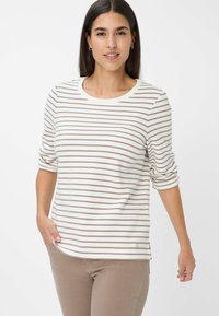 Gestreepte langemouwshirt met crèmekleurige en bruine horizontale strepen, ronde halslijn en opgerolde mouwen, gemaakt van zachte katoenstof.