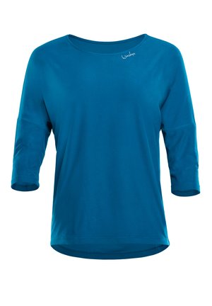 Turquoise three-quarter sleeve top with a round neckline, smooth texture, and a curved hem. Features a discreet logo near the collar.