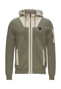 Olivgrüner Reißverschluss-Hoodie mit einem beigen Einsatz auf der Brust, strukturiertem Stoff, verstellbarem Kordelzug an der Kapuze und seitlichen Taschen.