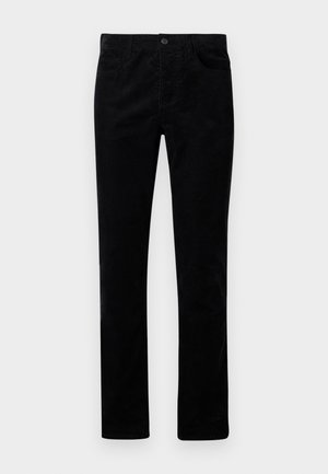Pantalons en velours côtelé noirs avec une coupe droite, dotés de poches avant et d'une fermeture par bouton en métal. Texture douce avec des côtes verticales.