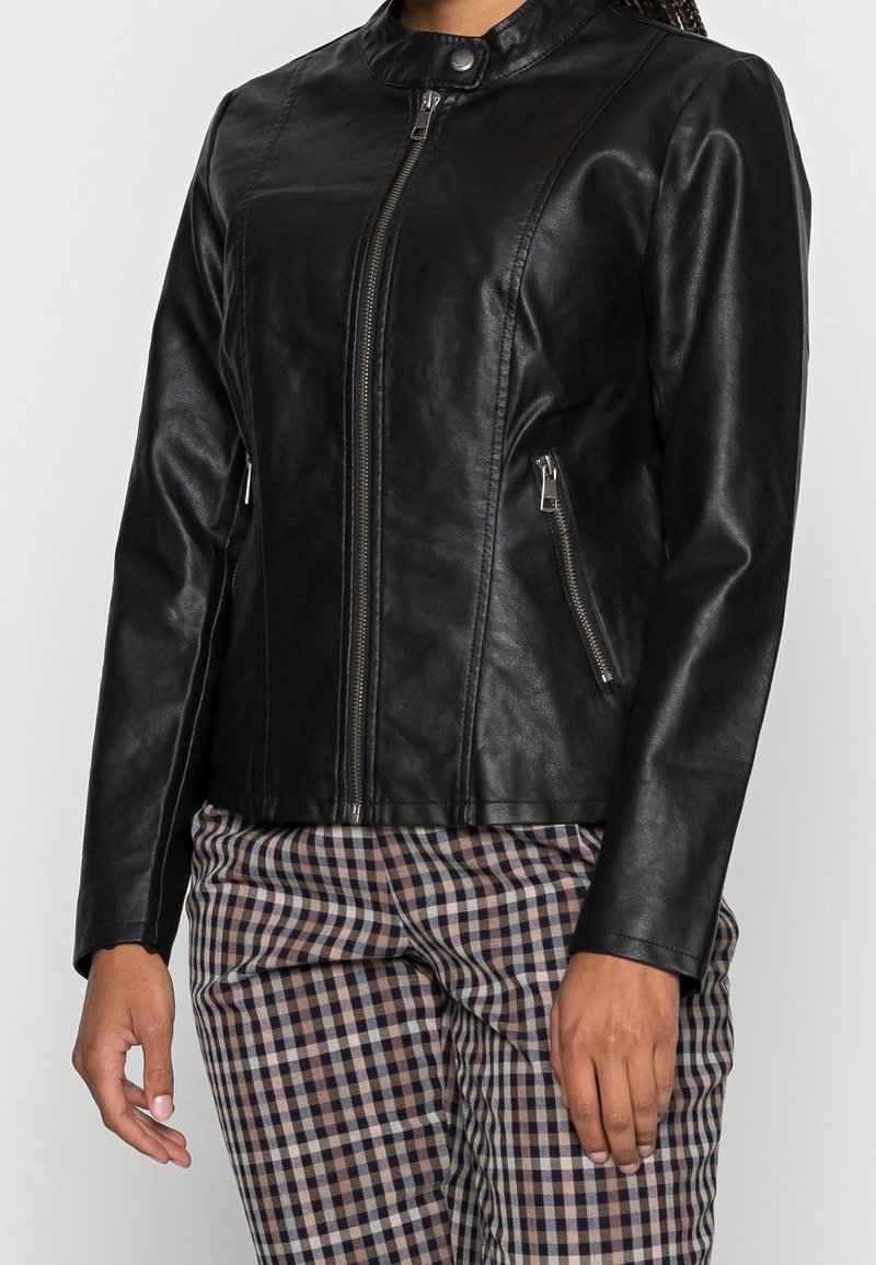 Black faux leather jacket with a high collar, front zip closure, and zippered side pockets. Smooth texture, fitted design, and sleek silhouette.