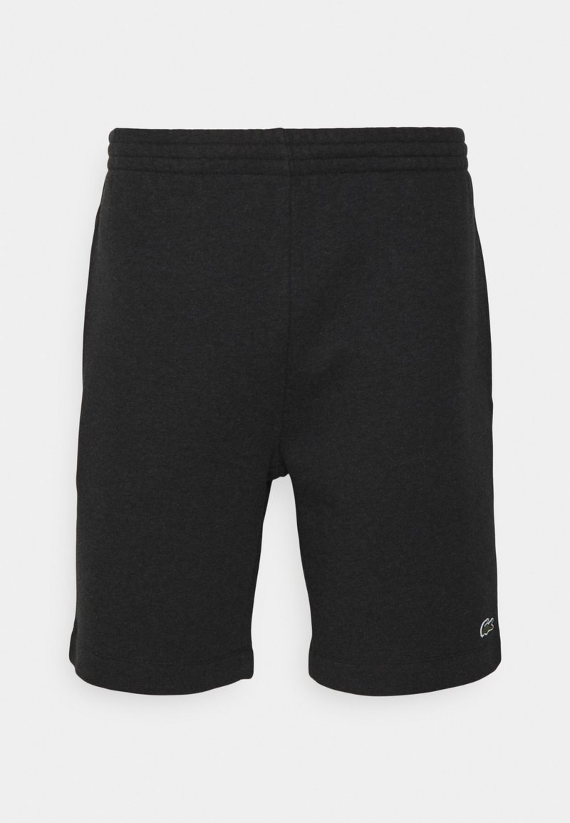 Svarta bomullsshorts med elastisk midja, släta sömmar och en Lacoste-logotyp nere till höger. Slät yta och knälång design.