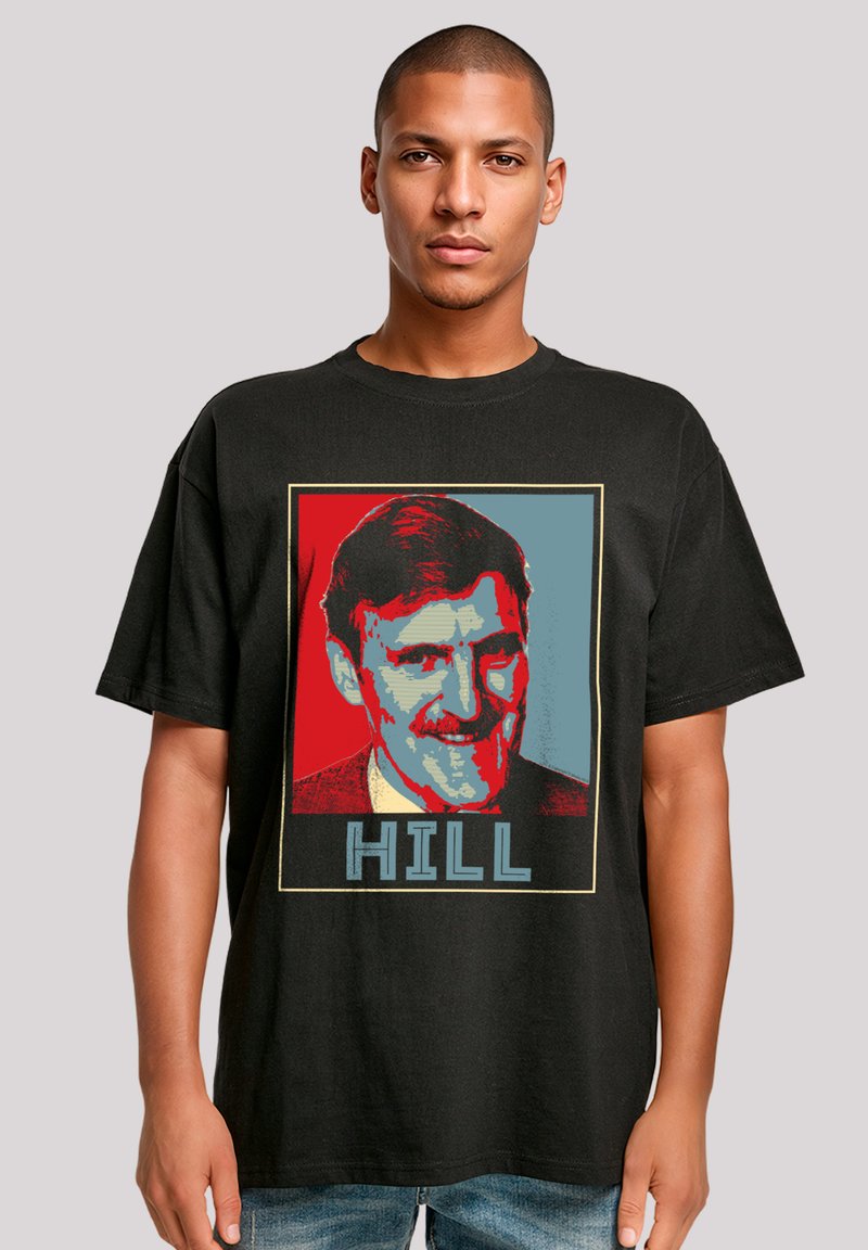 Black cotton t-shirt featuring a pop art style graphic of a man’s face in red and blue, with the word "HILL" below in bold letters.